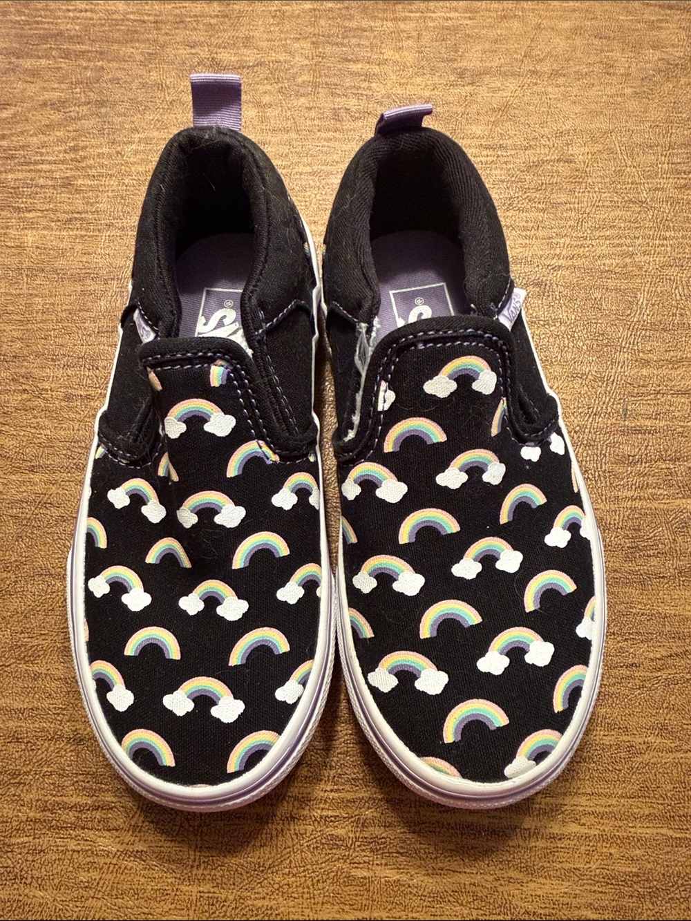 Vans Kids Slip-On Sneakers in Black with Rainbow Print